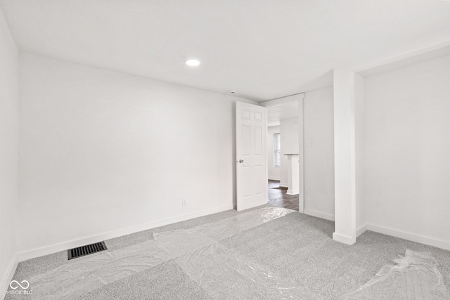 2321 W 26th St, Anderson, IN 46016 - carpeted empty room featuring baseboards and recessed lighting