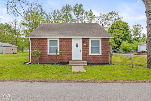 2321 W 26th St, Anderson, IN 46016 - bungalow with brick siding and roof with shingles