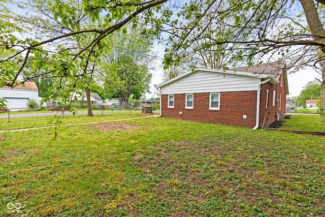2321 W 26th St, Anderson, IN 46016 - view of side of home featuring brick siding