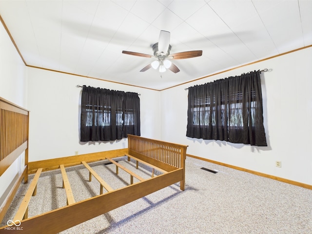 bedroom featuring baseboards, carpet flooring, and ornamental molding