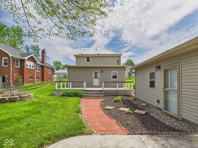 back of property featuring a deck
