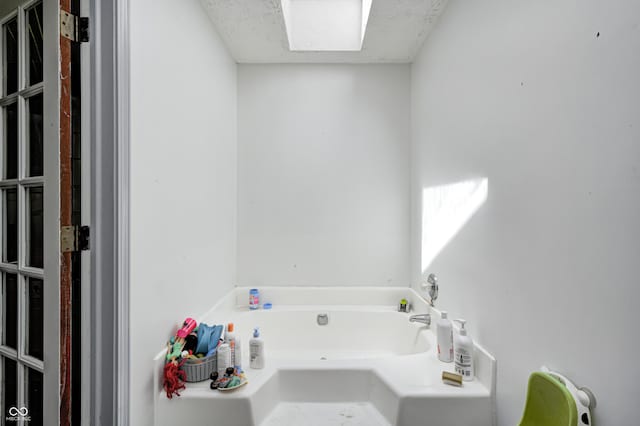 full bathroom with a garden tub