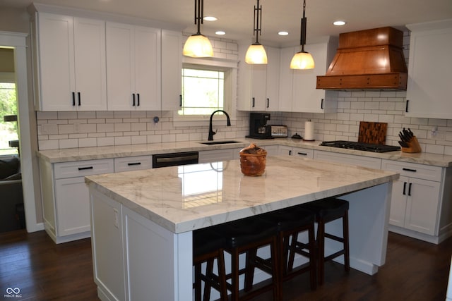 kitchen featuring custom range hood, black appliances, a sink, plenty of natural light, and recessed lighting