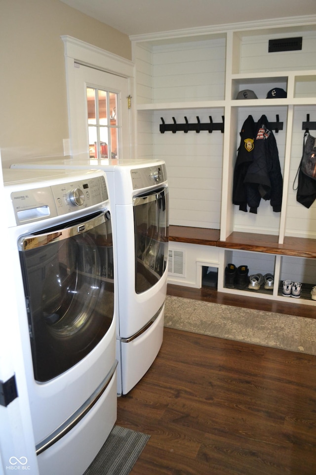 washroom featuring independent washer and dryer and dark wood-style flooring