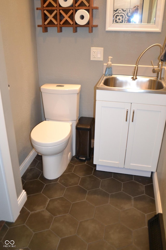 half bath with vanity and toilet
