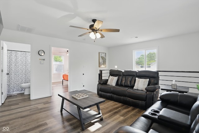 living area with ceiling fan and wood finished floors