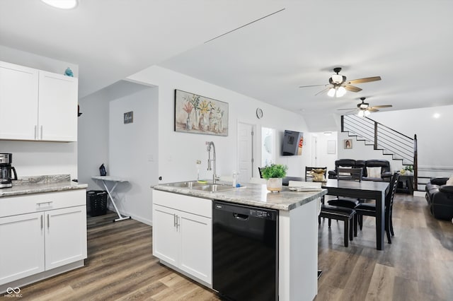 kitchen featuring dishwasher, a sink, ceiling fan, wood finished floors, and open floor plan