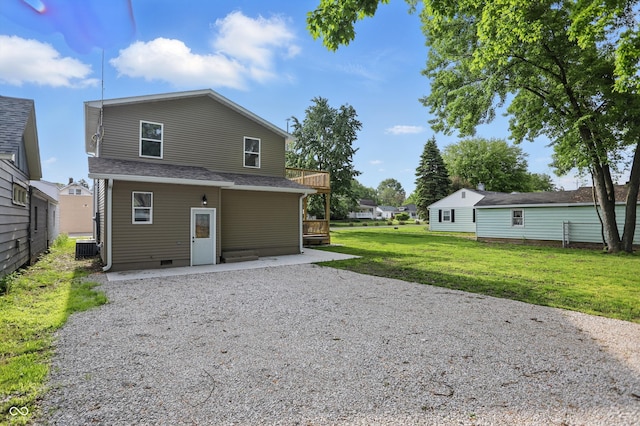 back of property with a yard, a patio, crawl space, central AC, and a wooden deck