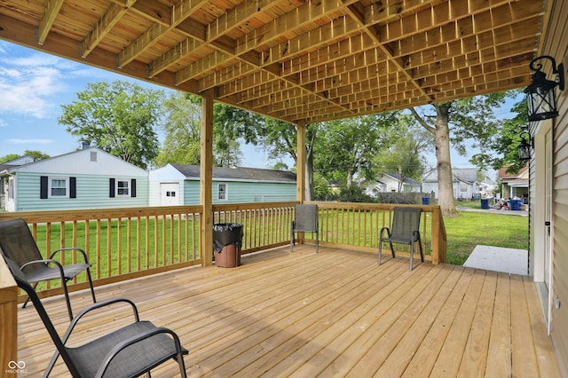 deck with a lawn and a residential view