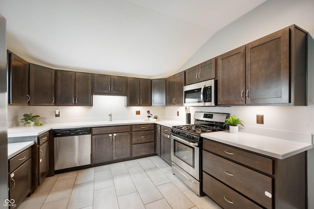 3019 W Huntsville Rd, Pendleton, IN 46064 - kitchen with stainless steel appliances, lofted ceiling, a sink, dark brown cabinets, and light countertops