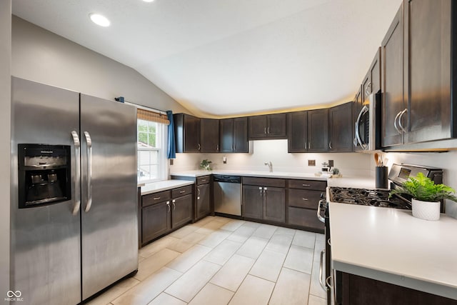 3019 W Huntsville Rd, Pendleton, IN 46064 - kitchen featuring appliances with stainless steel finishes, lofted ceiling, dark brown cabinetry, light countertops, and a sink