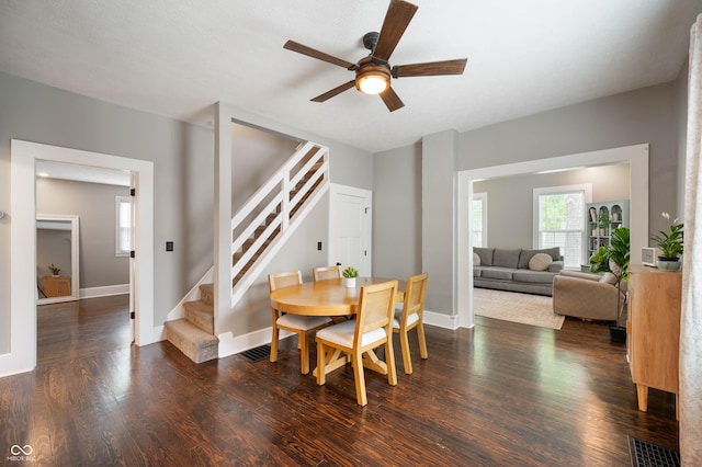 3019 W Huntsville Rd, Pendleton, IN 46064 - dining room featuring stairway, ceiling fan, dark wood-type flooring, and baseboards