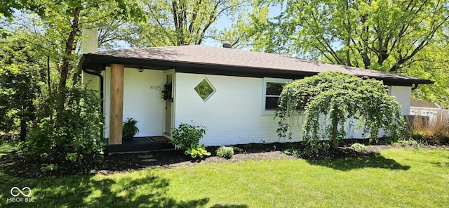 4105 N Cozy Hollow Ln, New Castle, IN 47362 - view of front of property featuring a front lawn, a chimney, and roof with shingles