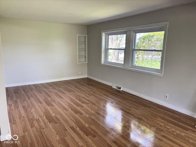4105 N Cozy Hollow Ln, New Castle, IN 47362 - unfurnished room featuring wood finished floors and baseboards