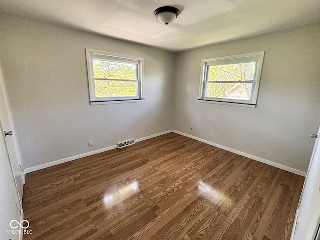 4105 N Cozy Hollow Ln, New Castle, IN 47362 - empty room with dark wood-style flooring and baseboards