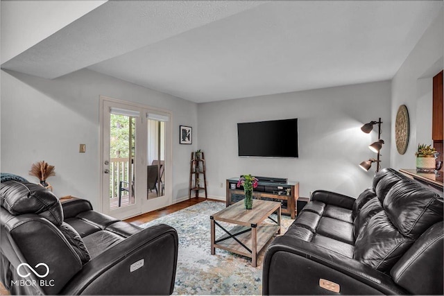 living area featuring wood finished floors and baseboards