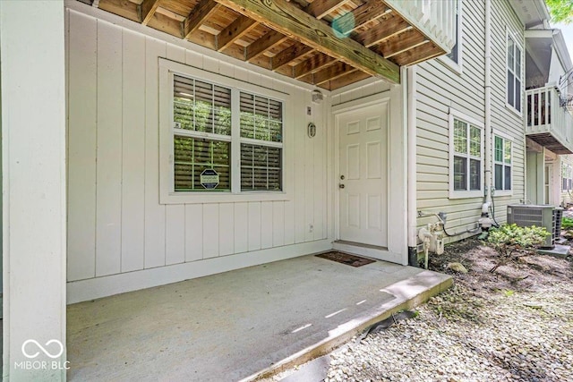 property entrance featuring central AC unit