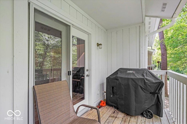 wooden terrace featuring grilling area