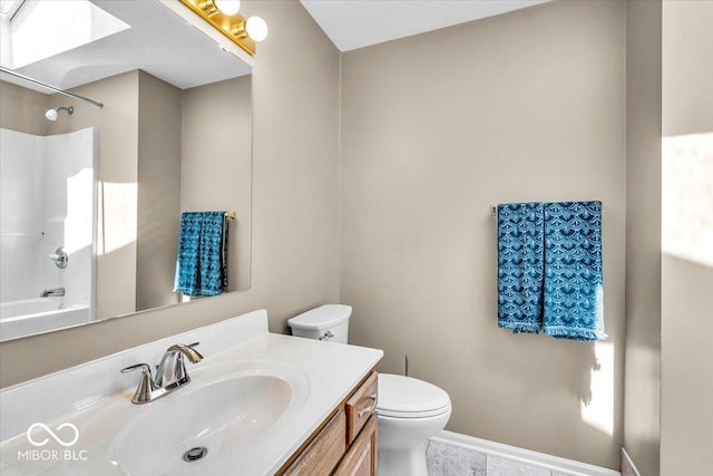 full bathroom with toilet, vanity, and shower / bath combination