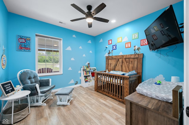 141 W 10th St, Seymour, IN 47274 - bedroom featuring wood finished floors, baseboards, recessed lighting, and a ceiling fan