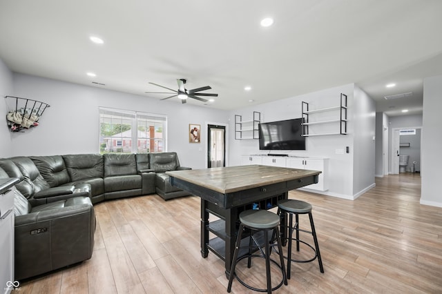 141 W 10th St, Seymour, IN 47274 - living room with ceiling fan, light wood-type flooring, recessed lighting, and baseboards