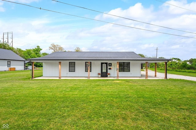 141 W 10th St, Seymour, IN 47274 - modern farmhouse style home featuring driveway, a front yard, covered porch, metal roof, and a carport