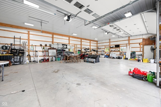 141 W 10th St, Seymour, IN 47274 - garage featuring a workshop area and a garage door opener