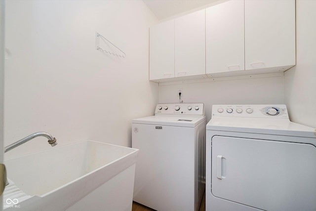 10833 Tournament Ln, Indianapolis, IN 46229 - laundry area featuring cabinet space and independent washer and dryer