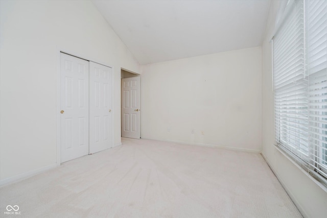 10833 Tournament Ln, Indianapolis, IN 46229 - unfurnished bedroom featuring carpet flooring, lofted ceiling, and a closet