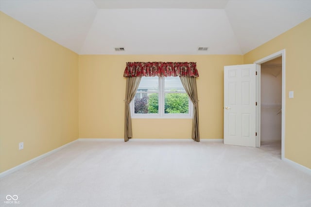 10833 Tournament Ln, Indianapolis, IN 46229 - empty room featuring vaulted ceiling and light colored carpet