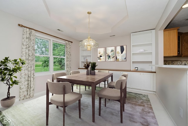 10833 Tournament Ln, Indianapolis, IN 46229 - dining room featuring a chandelier and built in shelves