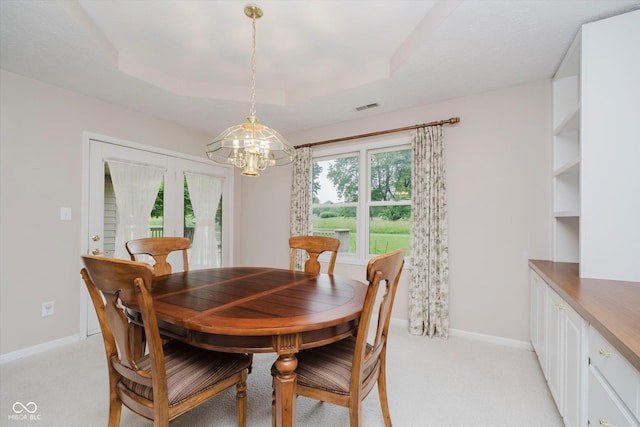 10833 Tournament Ln, Indianapolis, IN 46229 - dining area featuring a chandelier, plenty of natural light, and light colored carpet