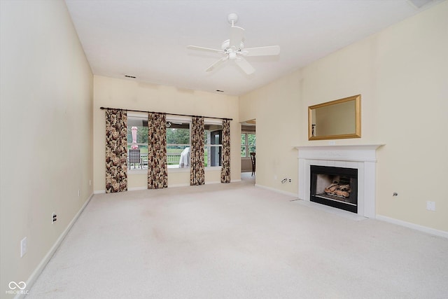 10833 Tournament Ln, Indianapolis, IN 46229 - unfurnished living room with a tiled fireplace, ceiling fan, and carpet flooring