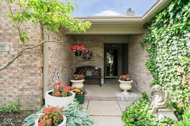 10833 Tournament Ln, Indianapolis, IN 46229 - property entrance with brick siding and a chimney
