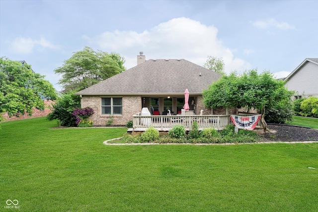 10833 Tournament Ln, Indianapolis, IN 46229 - back of property featuring brick siding, a lawn, a shingled roof, and a chimney