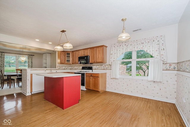 10833 Tournament Ln, Indianapolis, IN 46229 - kitchen with white appliances, light countertops, brown cabinetry, light wood-style floors, and glass insert cabinets