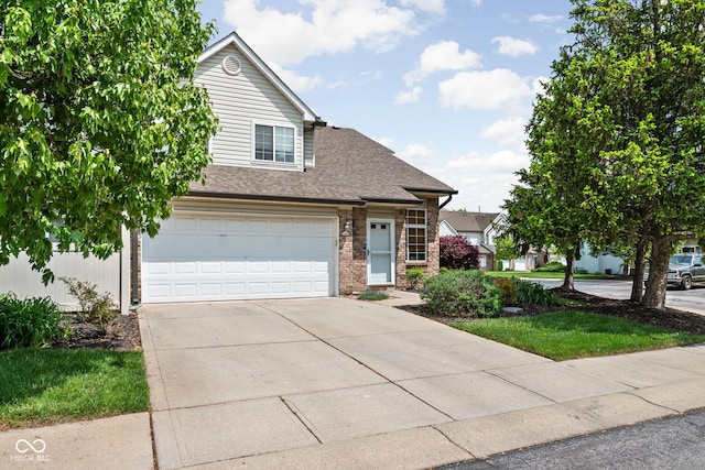 9404 Enclave Dr Unit D, Avon, IN 46123 - traditional-style house with driveway, brick siding, a shingled roof, and a garage