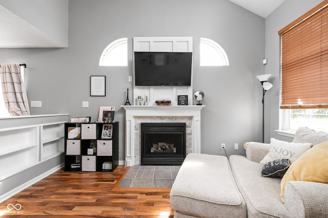 9404 Enclave Dr Unit D, Avon, IN 46123 - living area featuring high vaulted ceiling, wood finished floors, plenty of natural light, and a fireplace