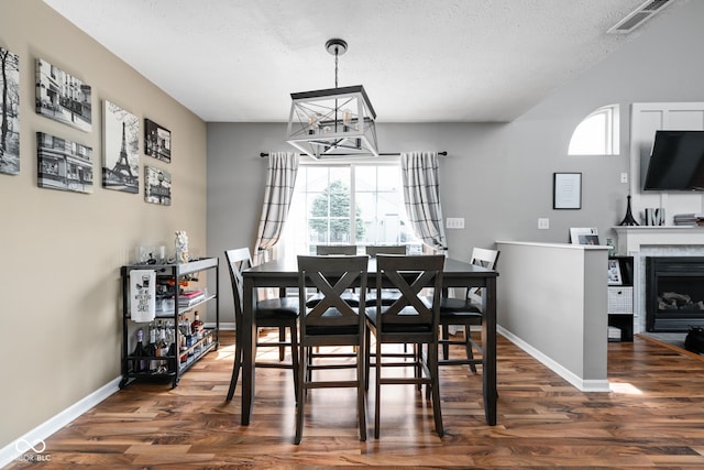 9404 Enclave Dr Unit D, Avon, IN 46123 - dining space featuring dark wood-type flooring, a chandelier, and a textured ceiling