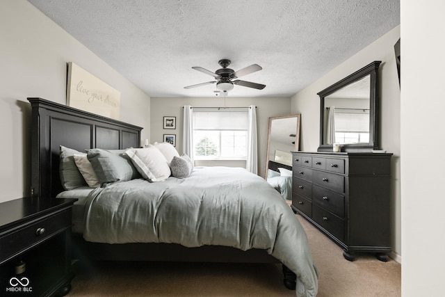9404 Enclave Dr Unit D, Avon, IN 46123 - bedroom with light carpet, a ceiling fan, and a textured ceiling
