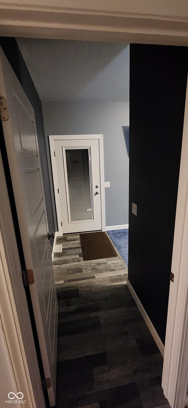5415 S Chalmers Ct, Bloomington, IN 47403 - hall featuring dark wood finished floors and baseboards