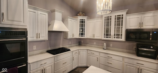 5415 S Chalmers Ct, Bloomington, IN 47403 - kitchen with black appliances, white cabinets, premium range hood, and light countertops