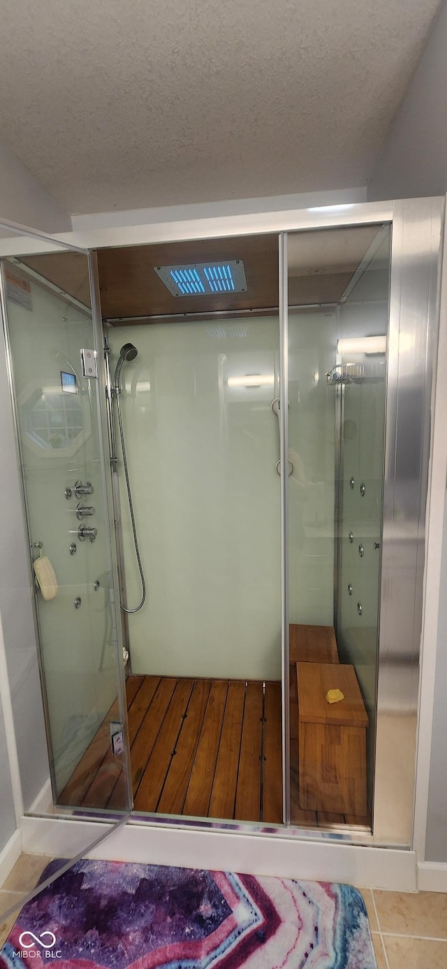 5415 S Chalmers Ct, Bloomington, IN 47403 - full bathroom featuring a shower stall, a textured ceiling, and tile patterned floors