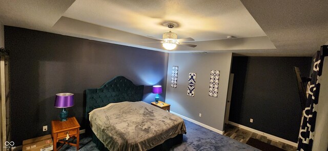 5415 S Chalmers Ct, Bloomington, IN 47403 - bedroom featuring a raised ceiling, baseboards, a textured ceiling, and ceiling fan