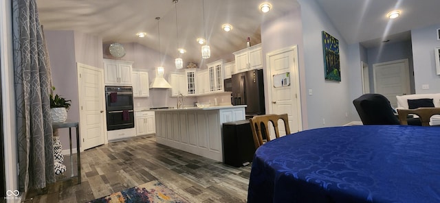 5415 S Chalmers Ct, Bloomington, IN 47403 - kitchen featuring black appliances, vaulted ceiling, premium range hood, dark wood-style floors, and a kitchen island