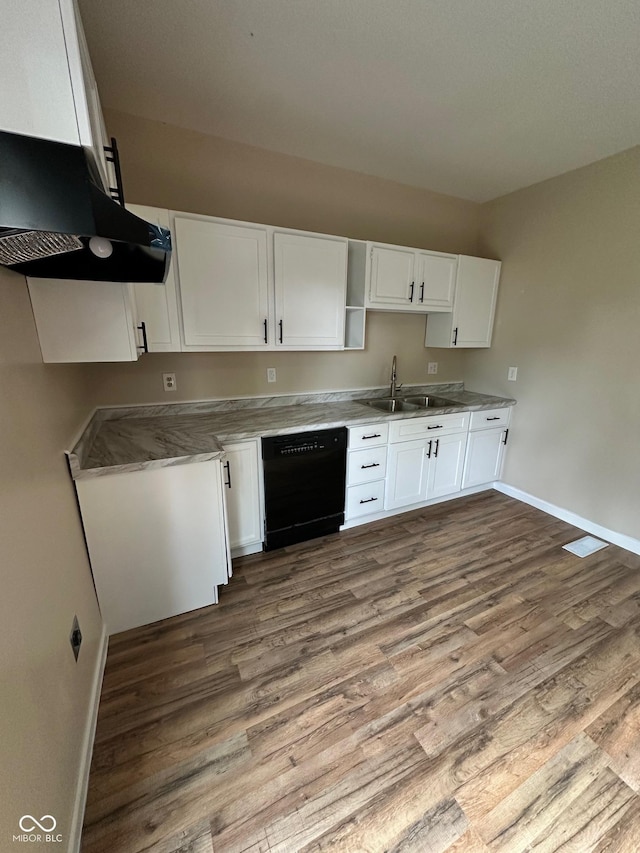 kitchen featuring black dishwasher, a sink, wood finished floors, white cabinets, and baseboards