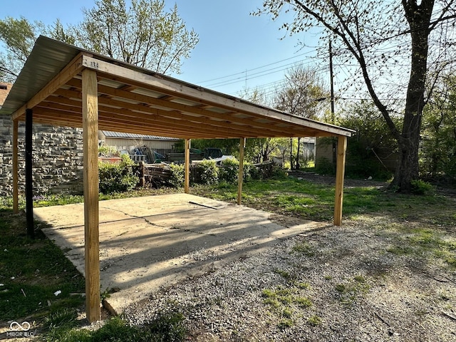view of vehicle parking with a detached carport