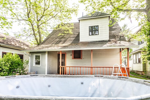 rear view of house with a porch