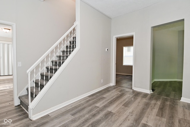 623 Orange St, Indianapolis, IN 46203 - stairs with wood finished floors and baseboards