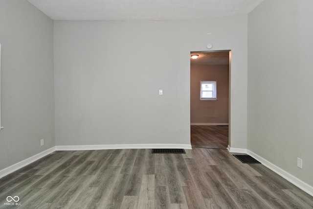 623 Orange St, Indianapolis, IN 46203 - unfurnished room with dark wood-style flooring and baseboards